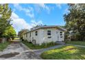 Cute bungalow with a well-maintained yard, driveway, and charming curb appeal at 906 Jurgens St, Clearwater, FL 33755