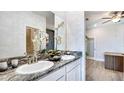 Modern double vanity bathroom with granite countertop at 4311 Pullet Ct, Lakewood Ranch, FL 34211