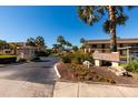 Landscaped entrance to Villas de Golf community at 12300 Vonn Rd # 7101, Largo, FL 33774