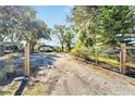 Gravel driveway leading to property at 11109 Sumner Rd, Wimauma, FL 33598