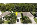 Property view from above showing house, yard, and neighboring houses at 16635 Myrtle Sand Dr, Wimauma, FL 33598