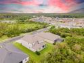 Aerial view of house and community with pool at 3138 Hilliard Dr, Wesley Chapel, FL 33543