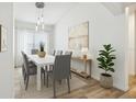 Bright dining room with modern lighting, seating for eight, and neutral decor at 4206 Branchside Ln, Wesley Chapel, FL 33543