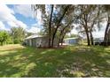Detached garages with ample space for parking and storage at 12805 Flint Creek Rd, Thonotosassa, FL 33592