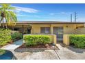 Ground floor condo unit with private patio and landscaping at 1308 13Th Se Cir, Largo, FL 33771