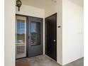 Condo entrance with private door and storage closet at 50 Coe Rd # 322, Belleair, FL 33756