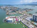 Waterfront property with docks, boat lifts, pool, and Gulf views at 241 Skiff Pt # 4, Clearwater Beach, FL 33767