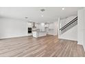Open living space with kitchen, island, and hardwood floors at 13728 Evergreen Valley Dr, Riverview, FL 33578