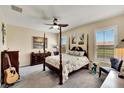 Main bedroom with post bed, ceiling fan and ample closet space at 242 Shell Falls Dr, Apollo Beach, FL 33572