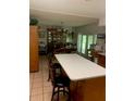 Kitchen features an island and eat-in area at 2705 Ranch Rd, Dover, FL 33527
