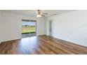 Bedroom with sliding glass door to backyard at 29736 Fedora Cir, Brooksville, FL 34602