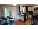 Charming kitchen with a breakfast nook and access to the backyard at 2392 Indigo Dr, Clearwater, FL 33763