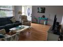 Cozy living room featuring hardwood floors and comfortable seating at 2392 Indigo Dr, Clearwater, FL 33763