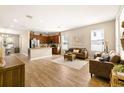 Open living and kitchen area with hardwood floors and comfortable seating at 1407 7Th N Ave, St Petersburg, FL 33705