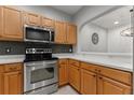 Updated kitchen featuring stainless steel appliances and wood cabinets at 214 Cape Harbour Loop # 105, Bradenton, FL 34212