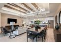 Open concept living space with kitchen, dining area, and high ceilings at 13716 Brookside Haven St, Riverview, FL 33578