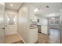 Entryway with view into kitchen and dining area; simple design at 306 Killinger Ave, Spring Hill, FL 34606