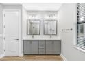 Double vanity bathroom with gray cabinets at 5934 Summit View Dr, Brooksville, FL 34601