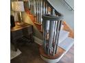 Elegant staircase with a wooden handrail and carpeted steps at 2255 Trelain S Dr, St Petersburg, FL 33712