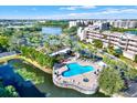 Community pool with surrounding patio and landscaping at 6251 Shoreline Dr # 2102, St Petersburg, FL 33708