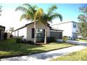 One-story house with brown garage door and landscaping at 7119 Salt River Ave, Sun City Center, FL 33573