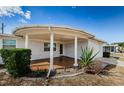 Covered porch with terracotta tile flooring at 1551 Derrick St, Holiday, FL 34690