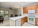 Kitchen features a breakfast bar and opens to the living room at 7219 Hamilton Rd # 7219, Bradenton, FL 34209