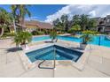 Relaxing pool and spa area with lounge chairs at 11901 4Th N St # 12107, St Petersburg, FL 33716