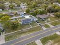 Aerial view of a renovated house with a large yard at 1009 Cobblestone Dr, Spring Hill, FL 34606