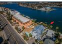 Aerial view showcasing home's waterfront location and proximity to the ocean at 10045 Gulf Blvd, Treasure Island, FL 33706