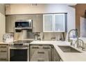 Modern kitchen with stainless steel appliances and quartz countertops at 100 4Th S Ave # 205, St Petersburg, FL 33701