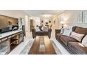 Spacious living room featuring comfortable sofas and a large TV at 4611 W Fig St # 209, Tampa, FL 33609