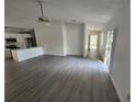Open concept living and kitchen area with gray flooring at 13625 Laraway Dr, Riverview, FL 33579