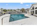 Community pool with lounge chairs and surrounding condos at 12267 Armenia Gables Cir # 12267, Tampa, FL 33612