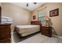 Small bedroom with a double bed and wooden furniture at 11537 Southern Creek Dr, Gibsonton, FL 33534