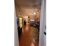 Living room with hardwood floors and access to other rooms at 2351 Bentley Dr, Palm Harbor, FL 34684