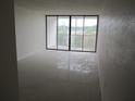 Spacious living room with tile flooring and open concept layout at 2424 W Tampa Bay Blvd # 107, Tampa, FL 33607