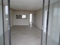 Spacious living room with sliding glass doors at 2424 W Tampa Bay Blvd # 107, Tampa, FL 33607