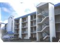 Three-story condo building with balconies and parking at 2424 W Tampa Bay Blvd # 108, Tampa, FL 33607