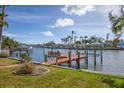 Private dock on calm waterway with lush landscaping at 8032 Causeway S Blvd, St Petersburg, FL 33707