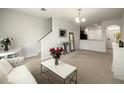 Bright and airy living room featuring a comfortable seating area at 10823 Verawood Dr, Riverview, FL 33579
