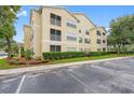 Building exterior with ample parking and well-manicured landscaping at 18593 Bridle Club Dr, Tampa, FL 33647