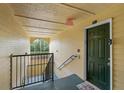 Interior stairwell with access to apartment unit at 18593 Bridle Club Dr, Tampa, FL 33647
