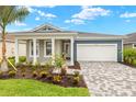 Attractive single-story home with a two-car garage and a well-manicured lawn at 11720 Renaissance Blvd, Venice, FL 34293