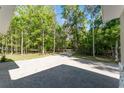 Long paved driveway leads to this wooded home, surrounded by trees at 22426 Golden Retriever Ln, Brooksville, FL 34601