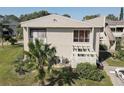 Exterior showcasing the well-kept landscaping and private entrance of this attractive residential property at 428 Windrush Bay Dr, Tarpon Springs, FL 34689