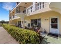 Condo patio with seating area and tropical plants at 2298 Netherlands Dr # 4, Clearwater, FL 33763
