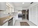 Bright kitchen with stainless steel appliances and granite countertops at 4028 Davit Dr # 4028, New Port Richey, FL 34652