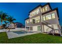 A gorgeous pool and a staircase in the back of the house at 2832 W Vina Del Mar Blvd, St Pete Beach, FL 33706