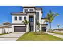Eye-catching home with a modern design, two-car garage, and lovely landscaping at 2832 W Vina Del Mar Blvd, St Pete Beach, FL 33706